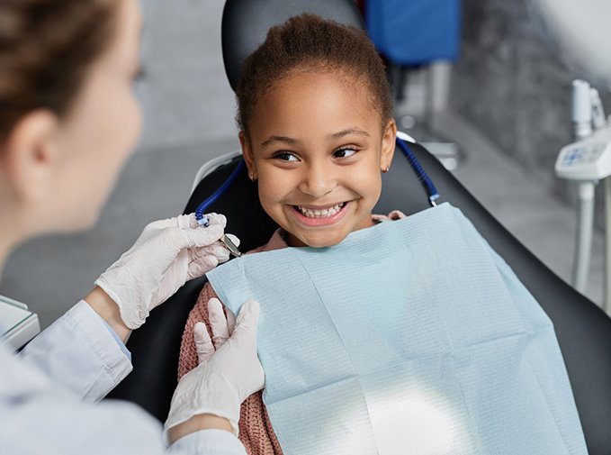 Happy young dental patient, ready for treatment