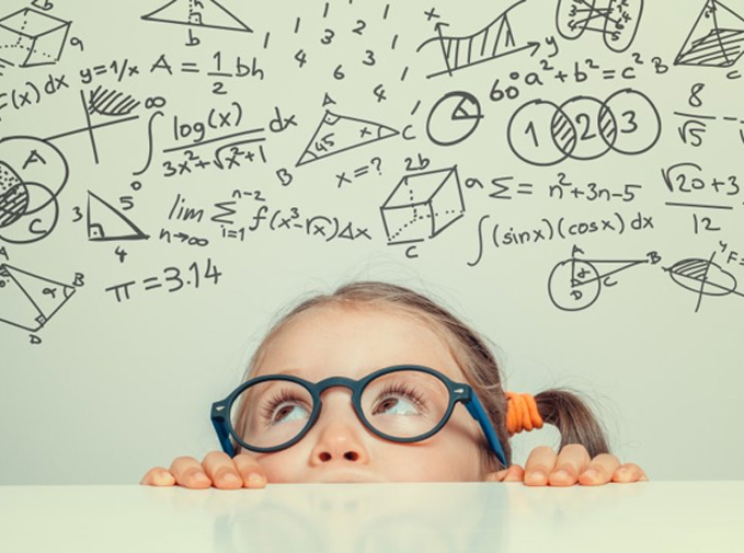 Child looking up at several math equations