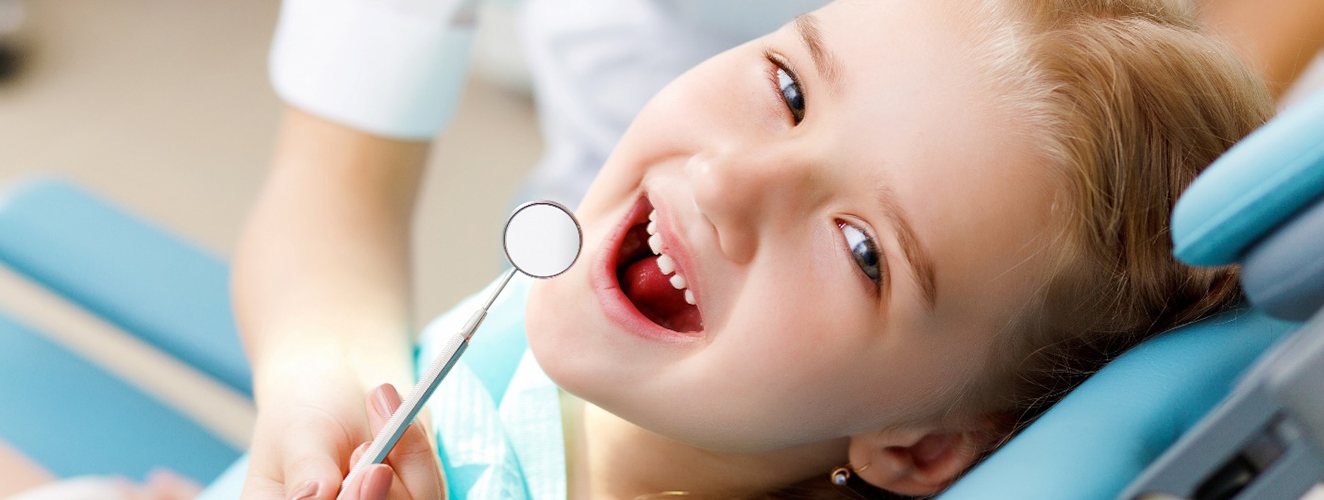 Cute little girl getting dental crowns in Inver Grove Heights