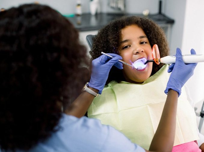 Young girl undergoing a dental checkup 