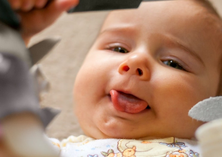 Baby sticking tongue out