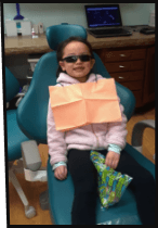 Smiling child in dental chair in Inver Grove Heights