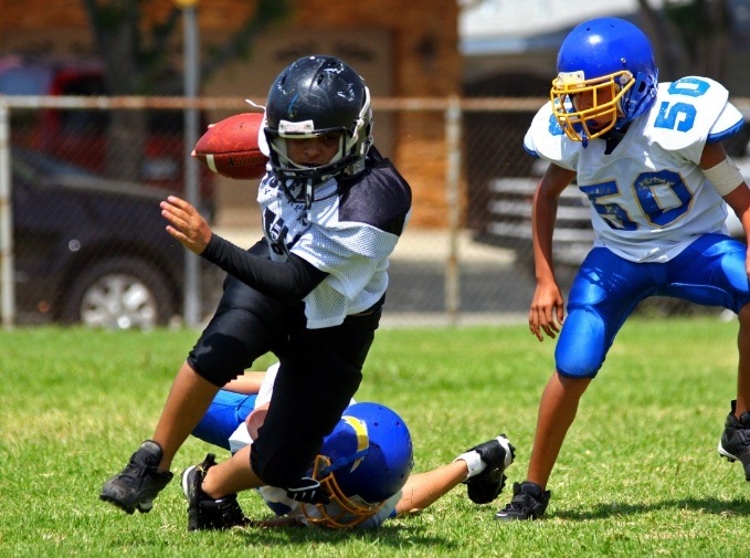 Young athletes wearing athletic mouthguards