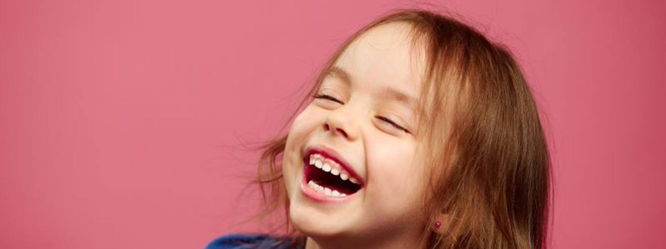 Portrait of laughing little girl