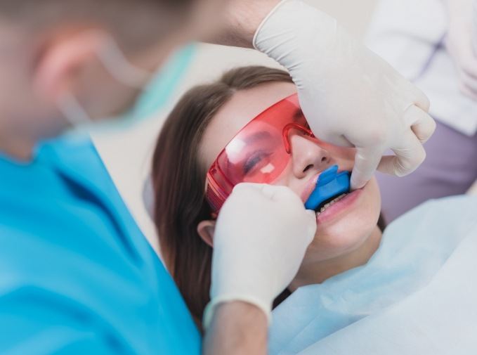 Child receiving silver diamine fluoride treatment