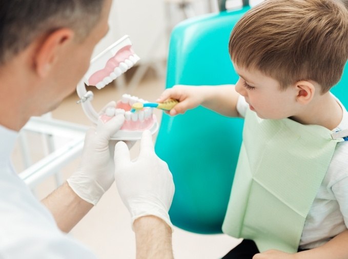 Child practicing tooth brushing after sedation dentistry visit