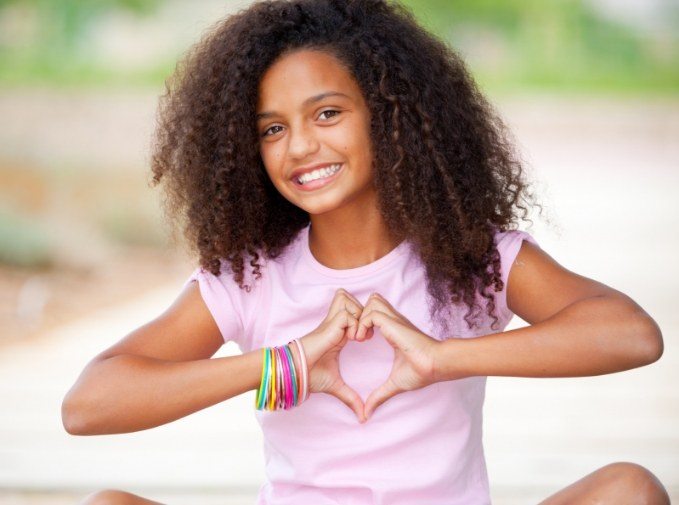 Young girl smile after comfortable pediatric dentistry using the Wand