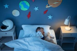 Young boy sleeping in his tastefully decorated room